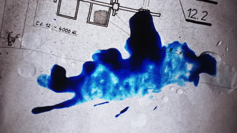 Blue-ink-dripping-onto-a-transparent-blueprint-of-an-apartment