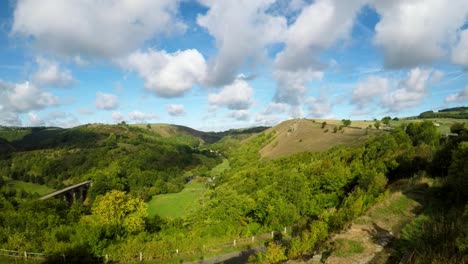 Drone-take-off-in-Bakewell,-Derbyshire-by-the-Headstone-Viaduct,-bridge,-commonly-used-by-cyclists,-hikers-and-popular-with-tourists-and-holiday-makers