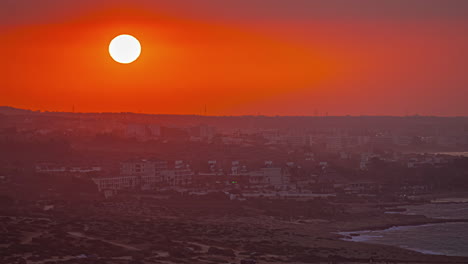 red sunrise over a city