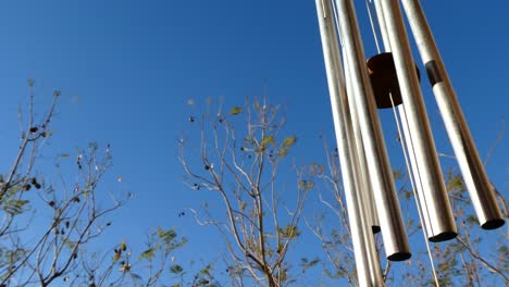 a beautiful view of a windchime hanging in the nature