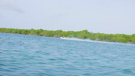 Wave-Runner-On-Caribbean-Ocean-Next-To-Island