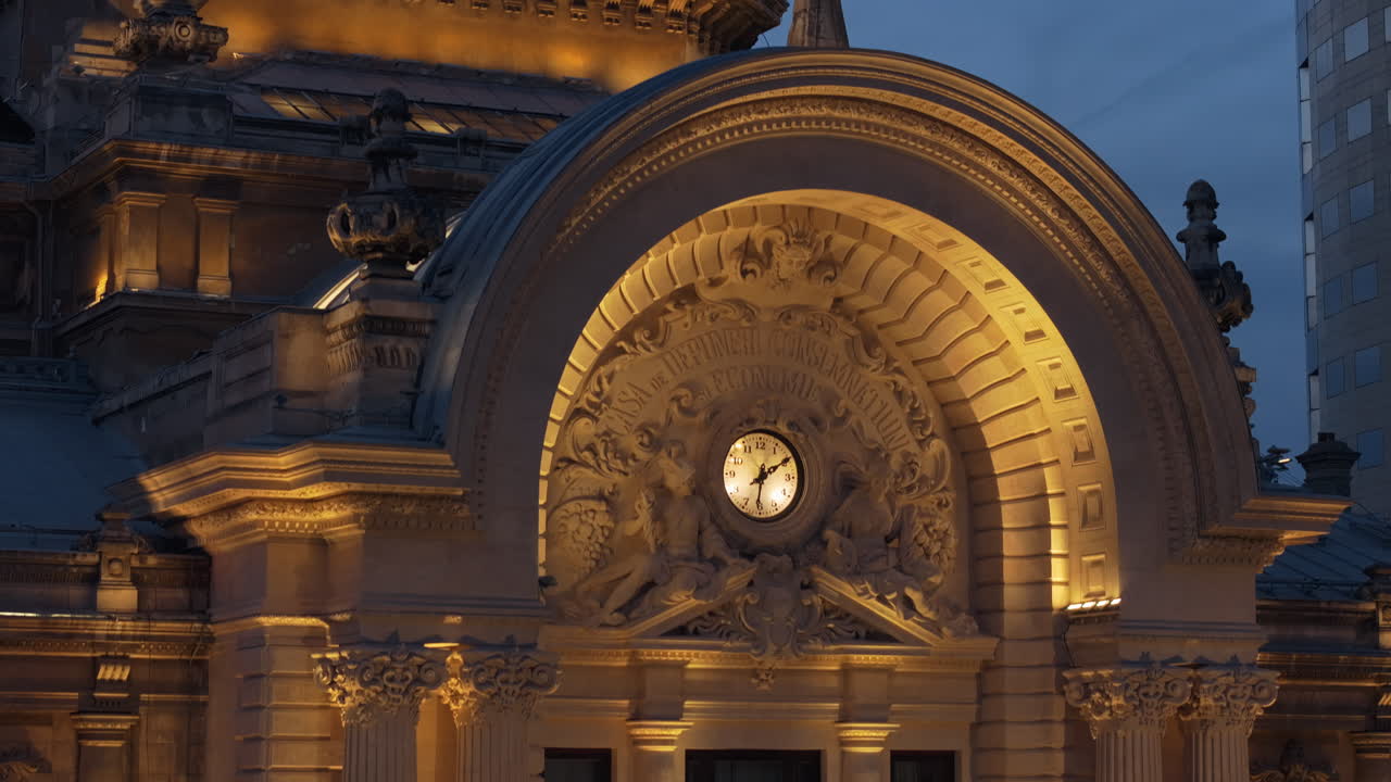 Aerial drone view of the illuminated Palace of the Deposits and Consignments in the evening. Blue hour in Bucharest, Romania