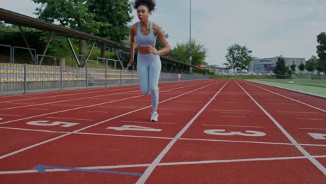 woman getting ready to run on a track