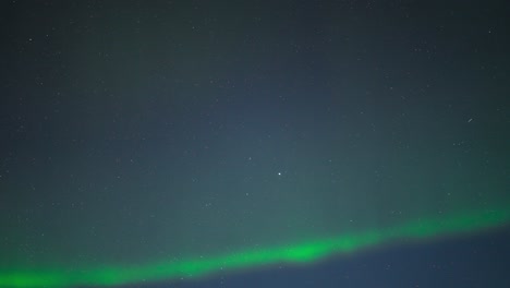 northern lights glowing in the night sky, timelapse capturing their movement