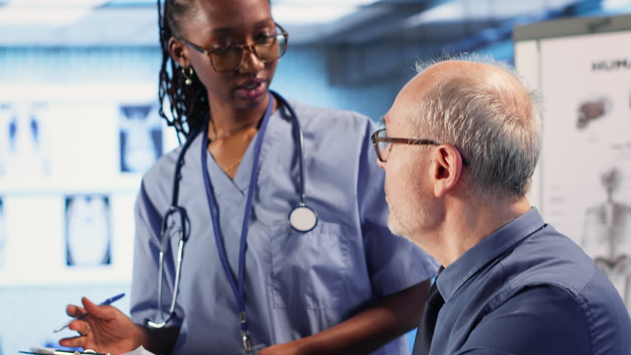 Vertical Video Expert and african american assistant provide medical services to patient