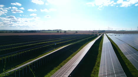 aerial backward over huge solar panel field green