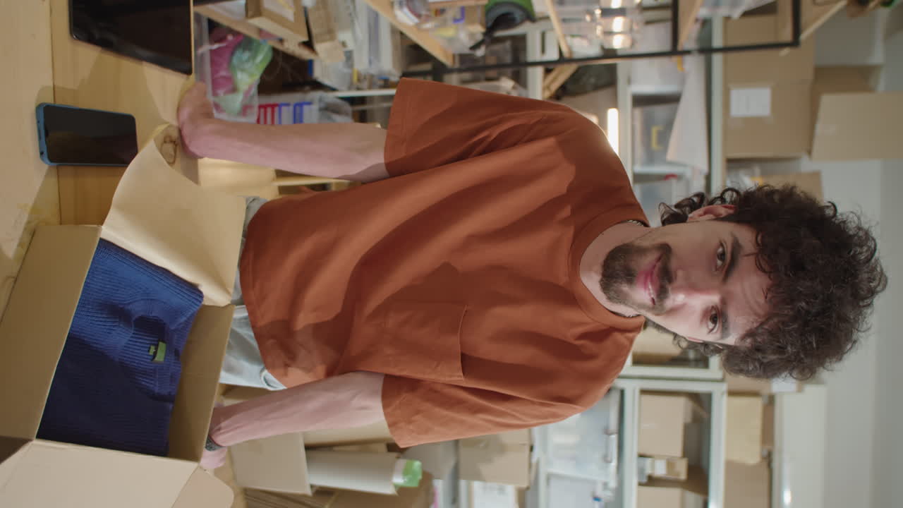 Portrait of Cheerful Male Worker in Online Store Warehouse