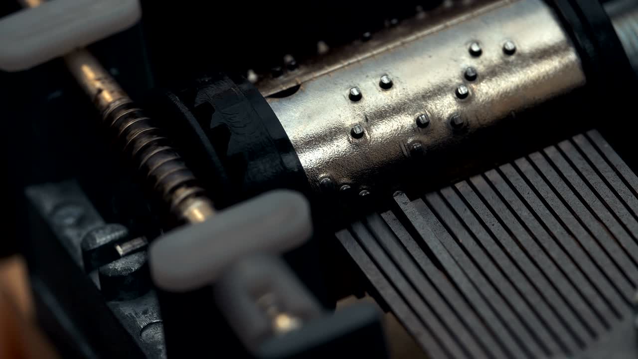 Detailed view of the insides of an old vintage music box as it plays. Slow tracking movements