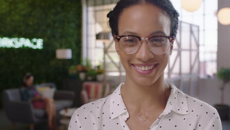 portrait-confident-business-woman-smiling-happy-entrepreneur-enjoying-successful-startup-company-proud-female-manager-wearing-glasses-in-trendy-office-workspace