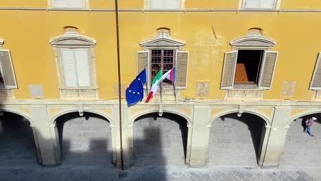 flags fly in the sun: european, italian and prato flags