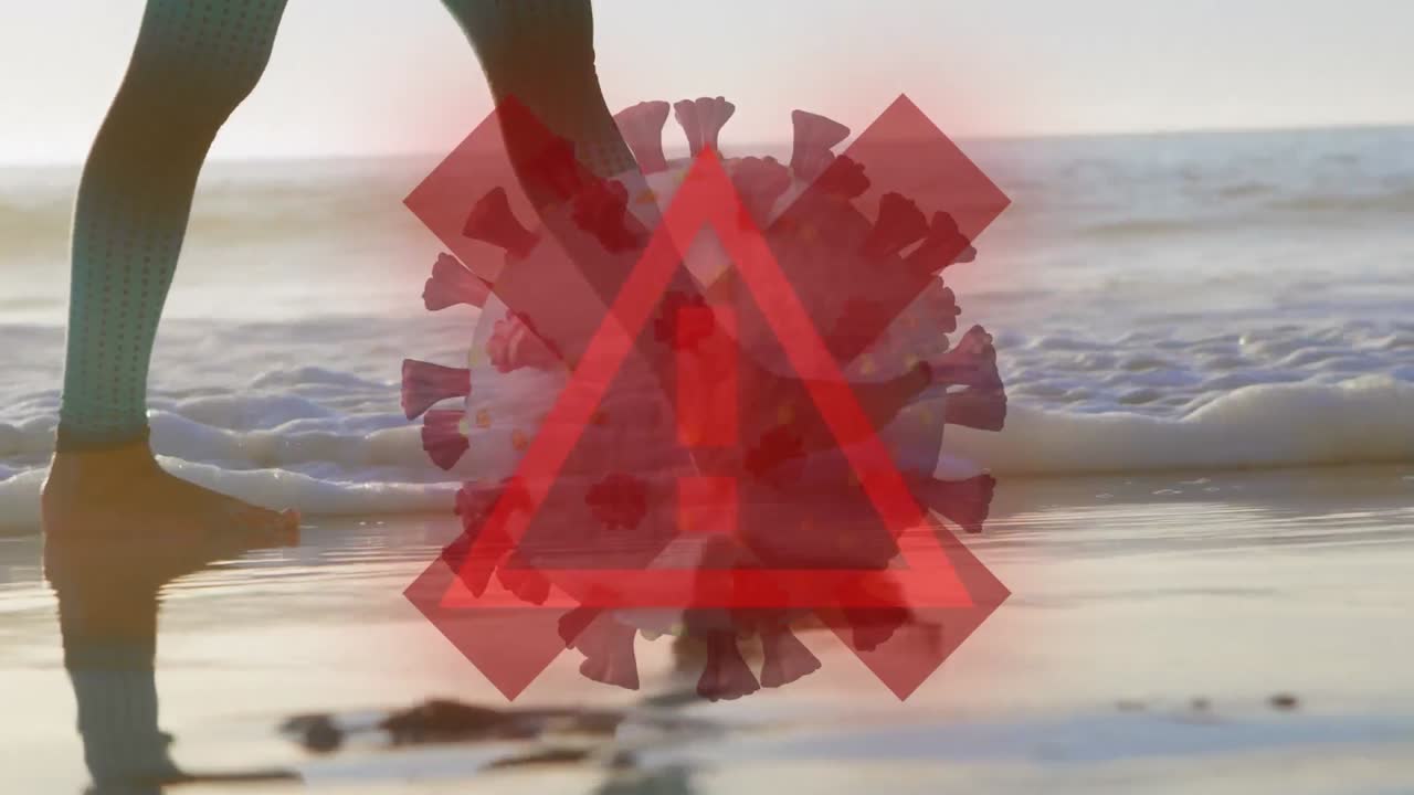 빨간 십자가와 코로나19 세포가 해변을 향해 움직이는 경고 표지판의 디지털 복합 비디오