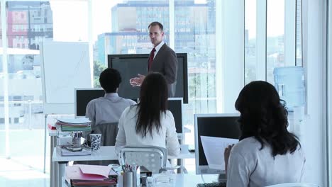 Businessman-addressing-his-team