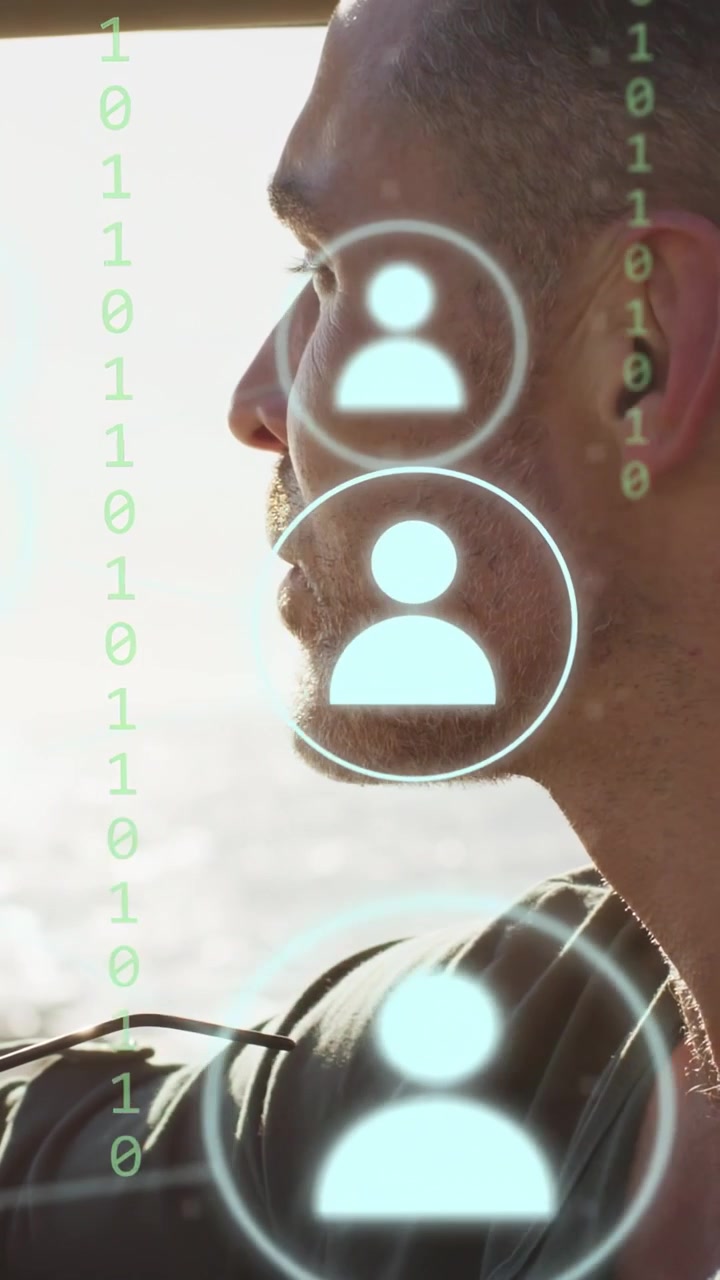 Vertical video: Man sitting in boat, HUD circle appearing over jaw, starting facial scan for ID