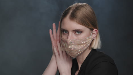 sensual woman in sparkly face mask