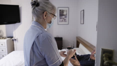 nurse caring for patient at home