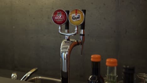 panning of a hotel lobby desk containing a beer tap, selfoss.