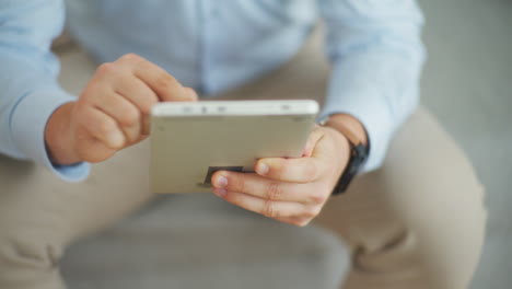 man manages online business remotely on tablet