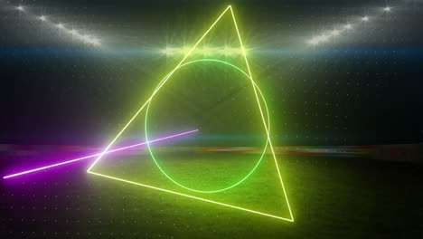 Animation-of-rotating-neon-shapes-and-lights-over-floodlit-sports-field
