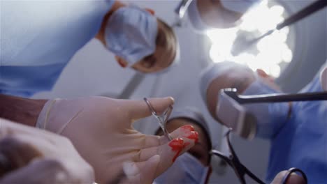 surgery team operating a patient in an operating room