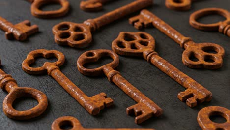 a collection of vintage keys with distinctive designs highlighting their intricate patterns and textures displayed on a dark surface