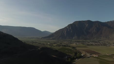 aerial view of a valley town nestled between mountains
