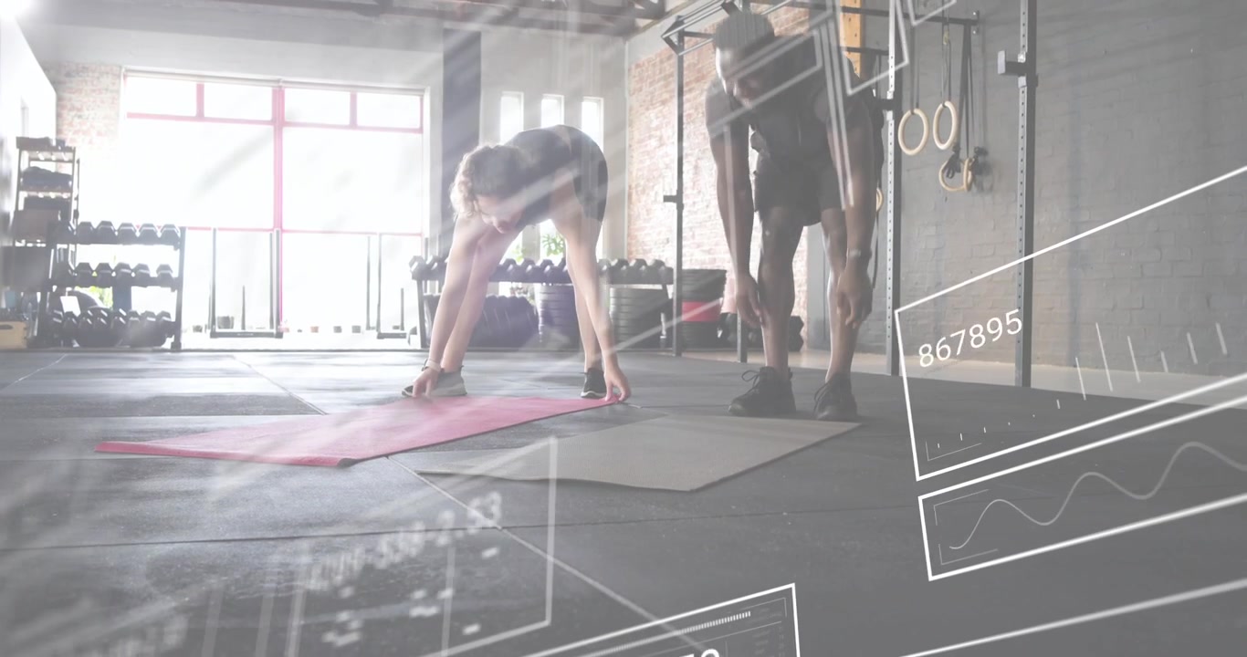 Fitness partners unrolling pink and gray mats, activating digital diagrams preparing workout