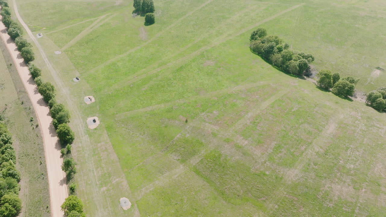 Aerial View Of Green Meadow With Trees, Shooting Range In Leach