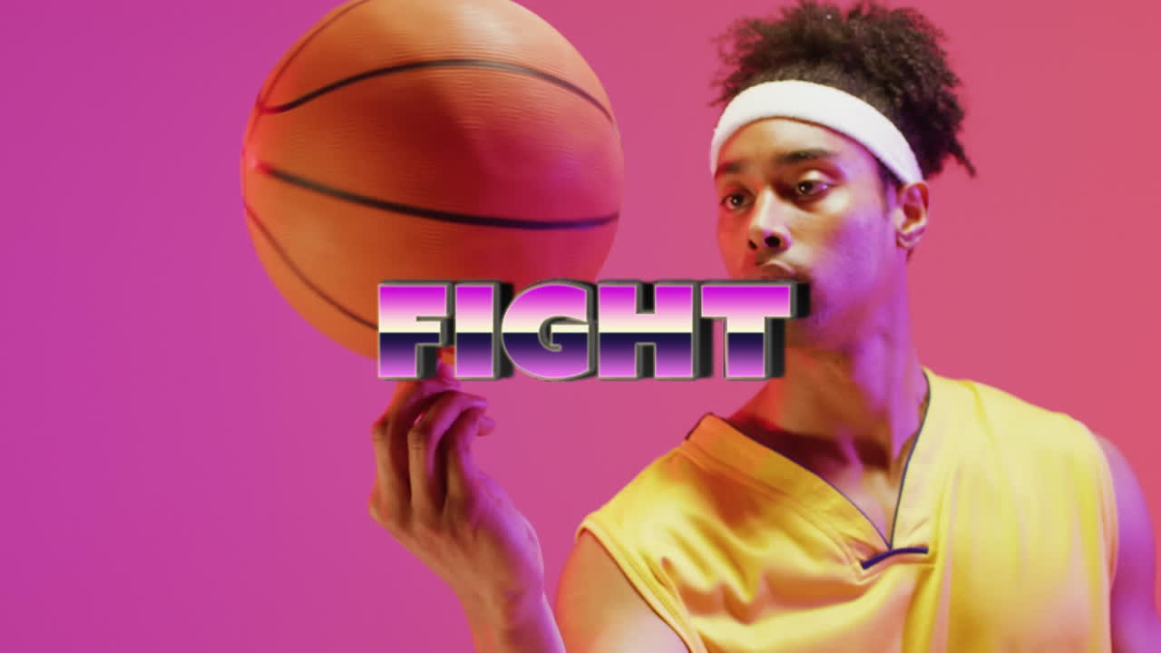 Animation of fight text over basketball player on neon background