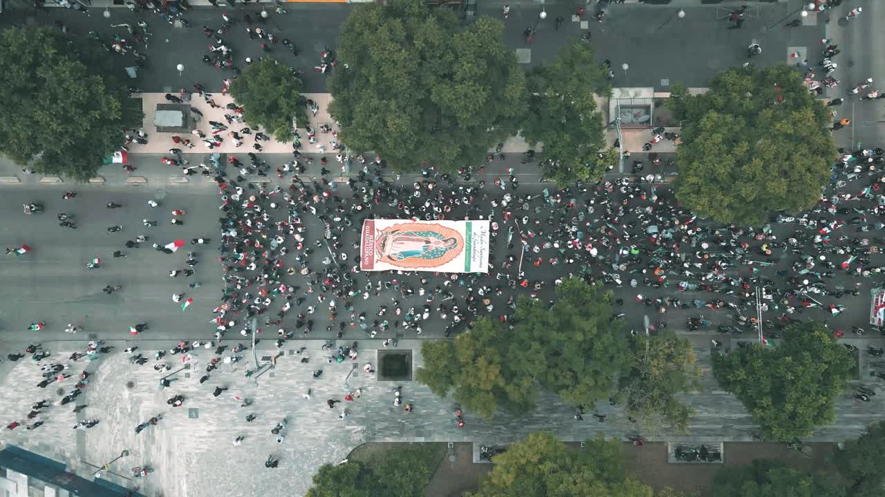 Virgen de Guadalupe Procession crossing Mexico city Main street