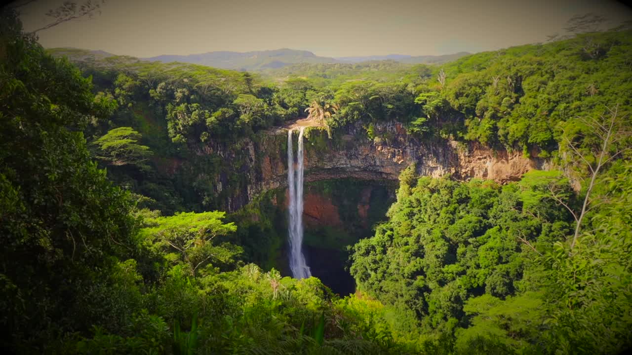 Majestic Waterfall in Lush Tropical Forest
