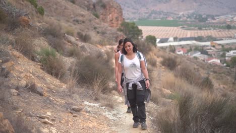 hikers group walk along a rout in the mountain