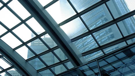 transparent roof and metal ceiling beams with sunshine through the glasses