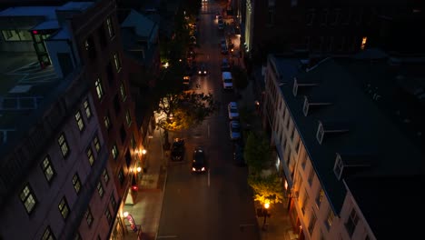 rising top down shot of traffic scene at night in american town