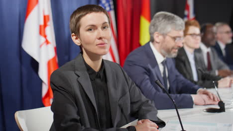 portrait of female diplomat at political press conference