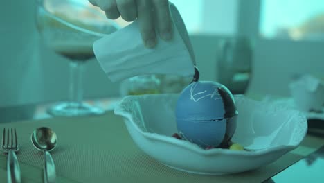 melting a souffle ball with hot chocolate, in a under water restaurant in the maldives