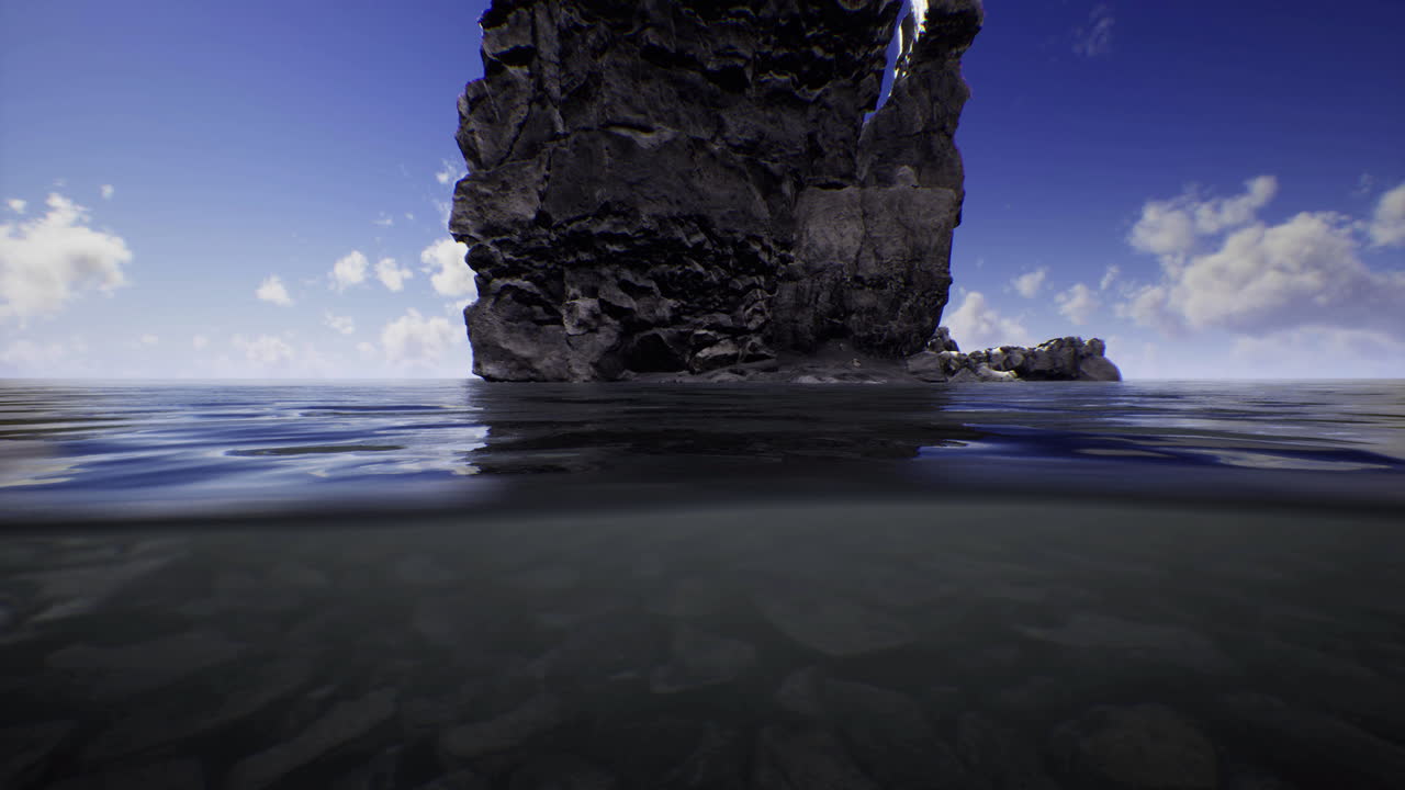 Tranquil coastal view with rock formation and calm waters during the day