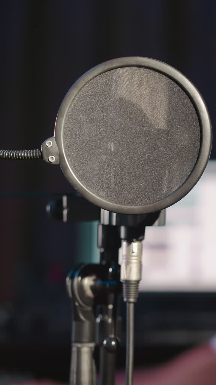 Audio director operates in music studio. Professional man fine-tunes track using mixing desk with computer. Process of musical art production