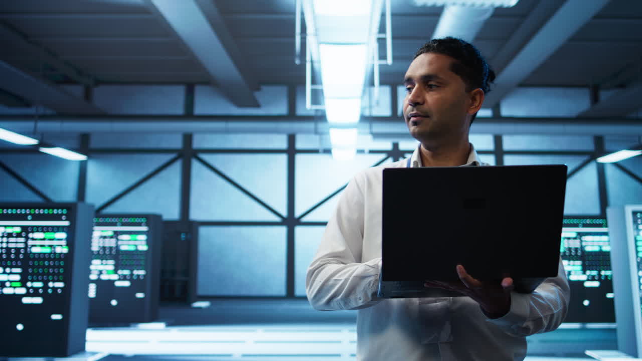 System administrator in data center managing servers