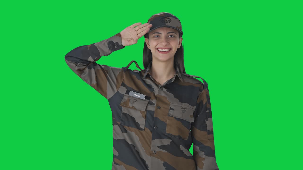 Happy Indian woman army officer saluting Green screen
