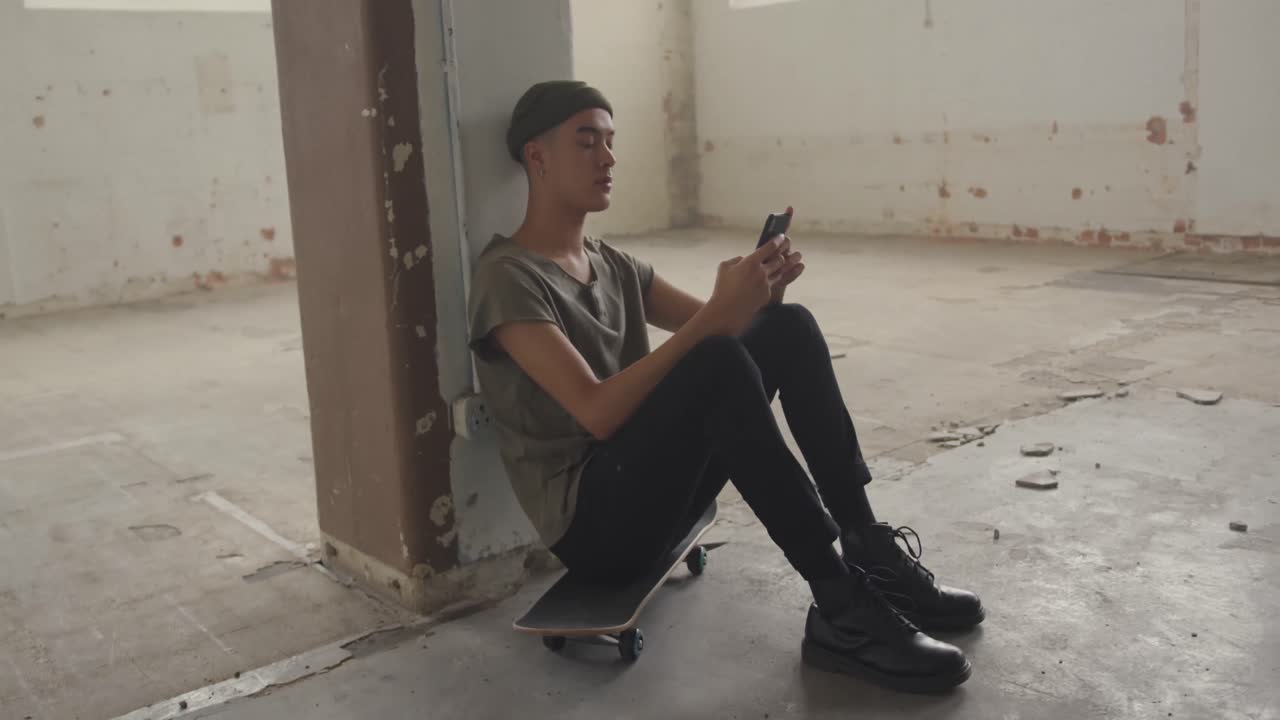 Fashionable young man in an abandoned warehouse