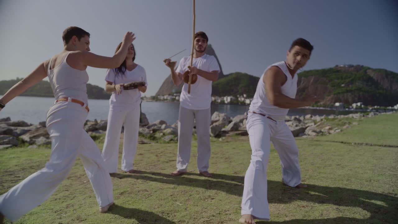 Capoeira Group Performing Outdoors by the Water
