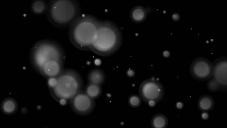 luces bokeh monocromáticas grises partículas fondo de movimiento abstracto