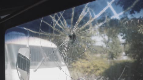 close up of broken bus window