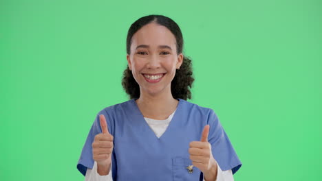 a smiling medical professional gives a thumbs up on a green screen background