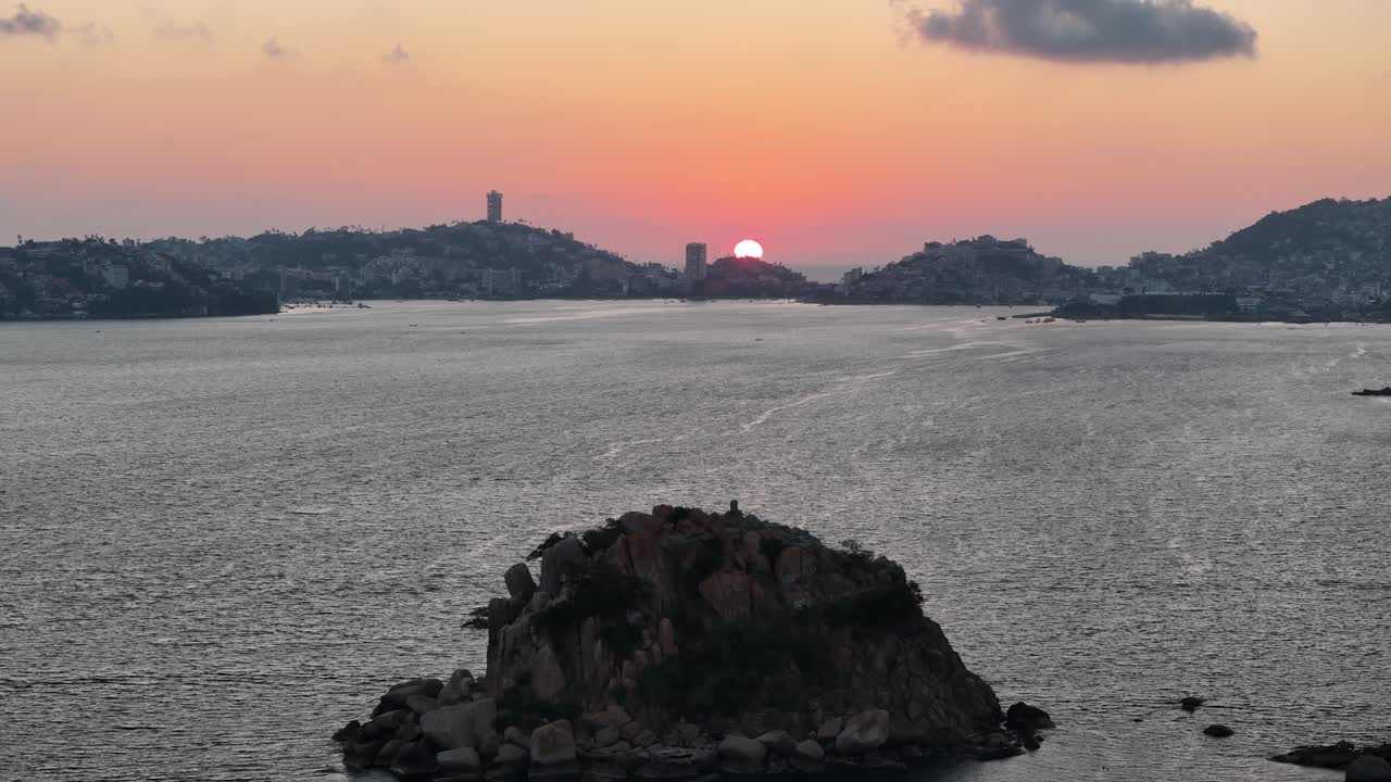 Shot of sunset in Acapulco farallón