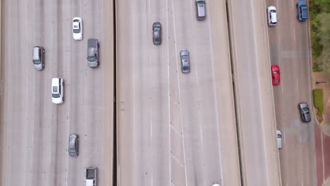 aerial view over cars on a freeway, in dallas, texas, usa - overhead, drone shot