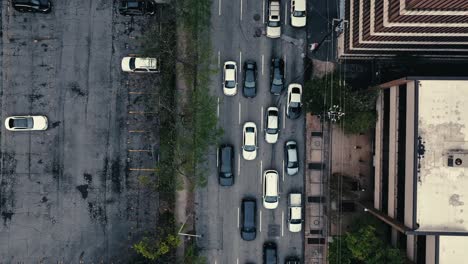 Cars-driving-in-Downtown-Atlanta,-Top-down-aerial-view-of-one-way-streets-with-multistorey-buildings,-parked-cars,-Georgia,-USA