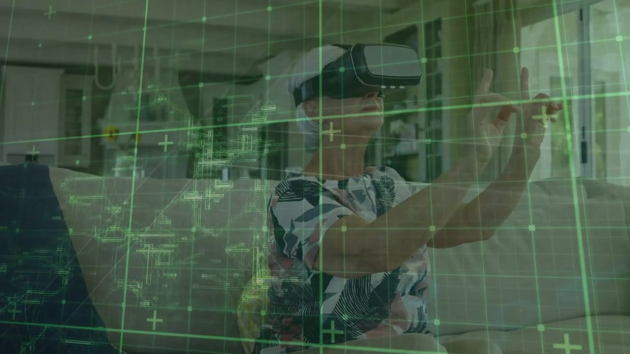 Vertical video: Green grid appearing senior woman patterned top controlling with VR headset on sofa