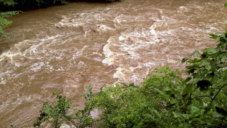 High-river-water,-storm-water-and-flooding-along-river-near-galax-virginia