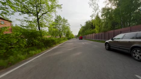 point of view footage of a car driving at high speed through a residential area in helsinki